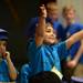 Justin Wellwood, 5, reaches his hands out toward the crowd during Safety Town graduation at Dicken Elementary School on Friday, July, 26, 2013. Melanie Maxwell | AnnArbor.com